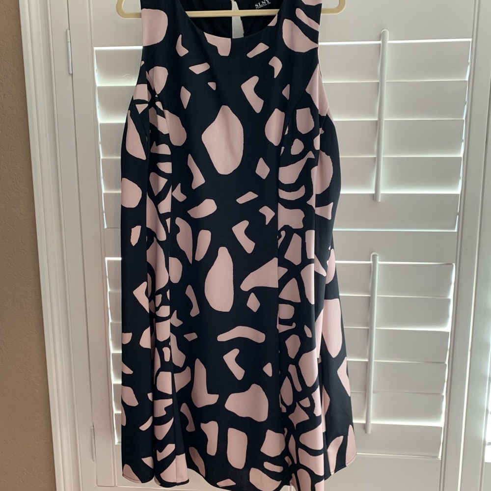 Black dress with pops of geometric shapes